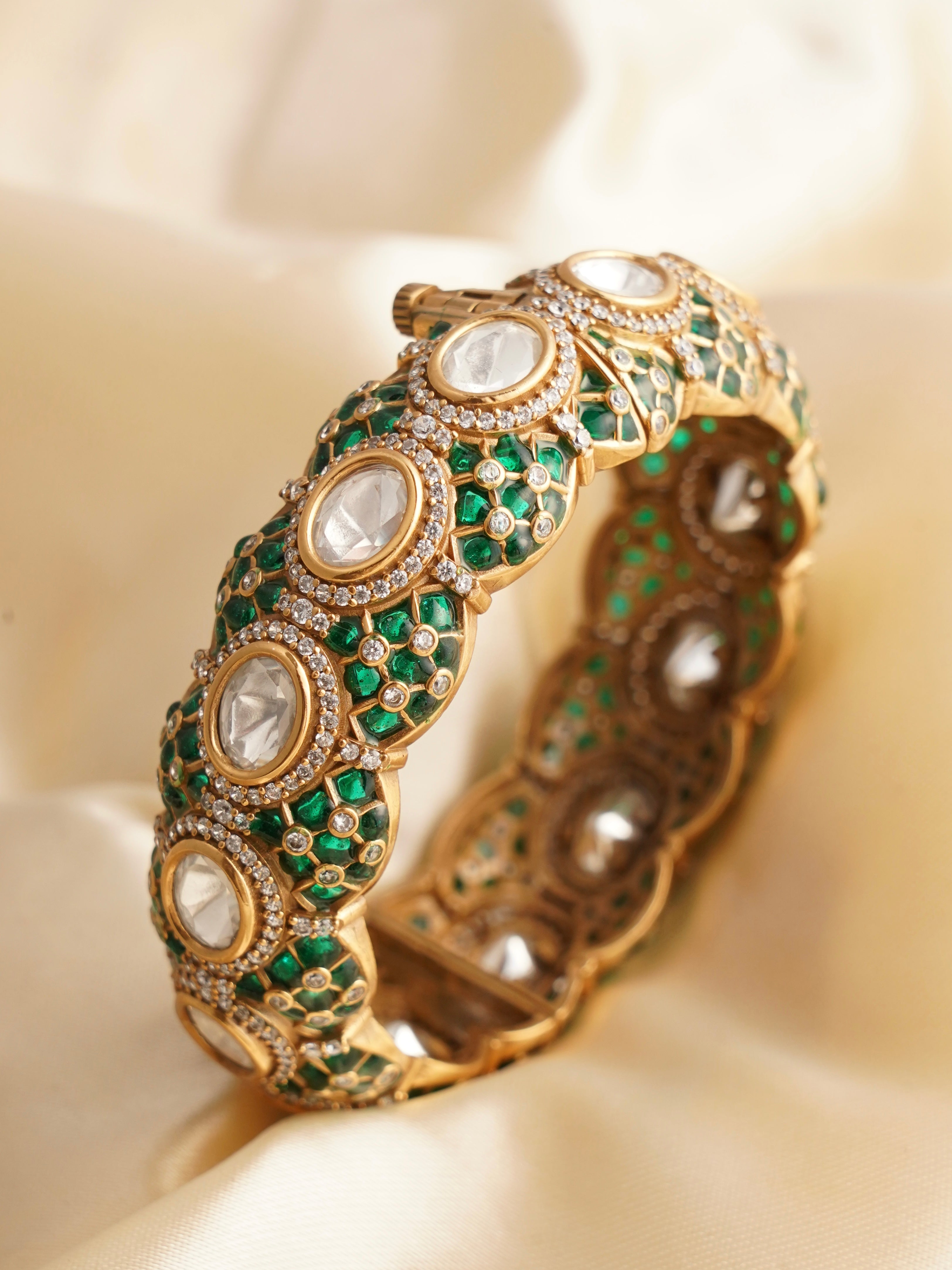 Side perspective of ruby kundan bangle showcasing sleek contours and sparkling stones